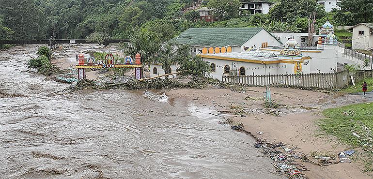 Floodwaters wash through a property near Durban, South Africa, Tuesday, April 23, 2019. South African media report Tuesday that at least 33 people are dead from flooding and mudslides in the country's eastern KwaZulu-Natal province caused by heavy rains that began on Monday. (AP Photo)