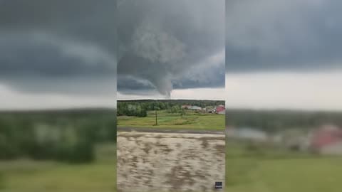 Twister Swirls Across Field as 8 Confirmed Tornadoes Rip Through Ohio