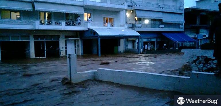 Floodwaters stream through a suburb of Athens, Greece.