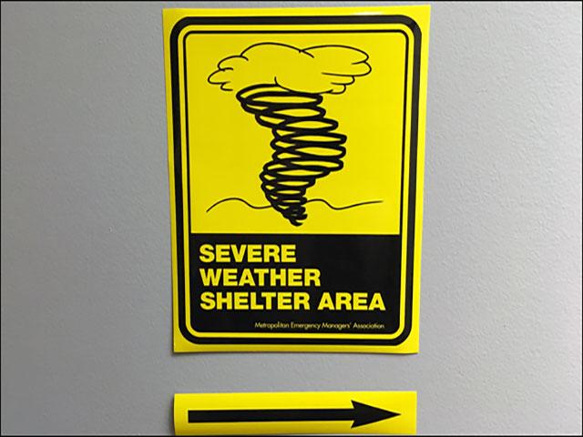 Aftermath following a severe thunderstorm is seen with a damaged silo and grain bin in the background. (Courtesy of NOAA)