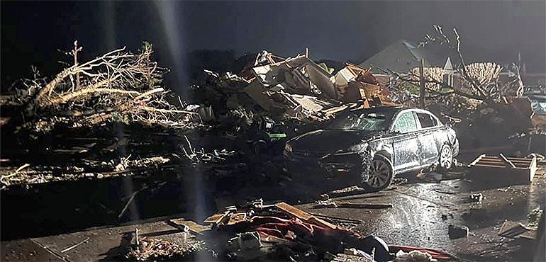 A damaged vehicle sits among debris after a deadly tornado tore through Brunswick County, N.C., Tuesday, Feb. 16, 2021. (Emily Flax/Brunswick County Sheriff’s Office via AP)