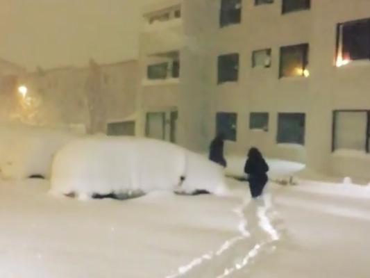 People walk to their car during a weekend blizzard in Reykjavik, Iceland. (Instgram/davideagle via Storyful)