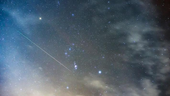 Orionid meteors in the constellation Orion. Vytautas Kielaitis/Shutterstock.com