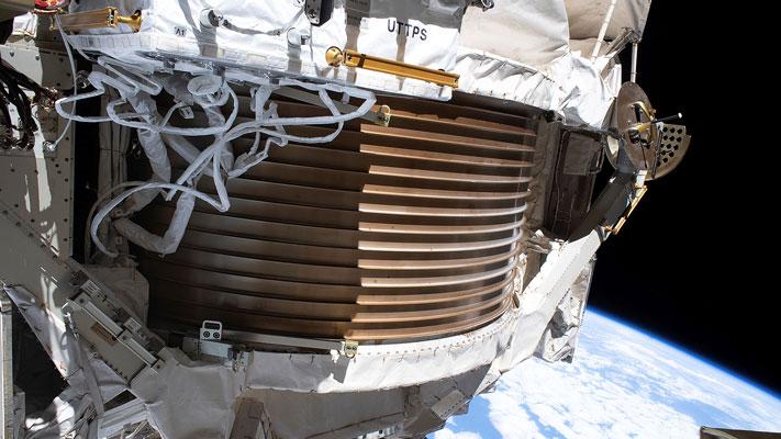 This Dec. 2, 2019 photo made available by NASA shows the Alpha Magnetic Spectrometer (AMS) attached to the International Space Station. (NASA via AP)