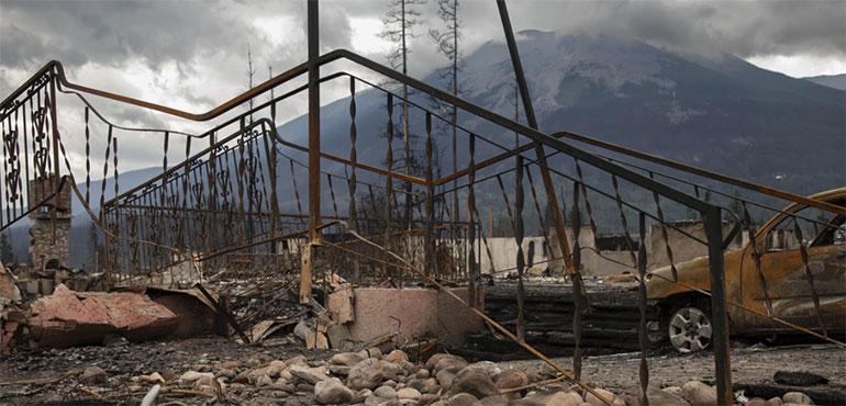 Damage is seen after a wildfire in Jasper, Alberta, Friday July 26, 2024. (Amber Bracken/The Canadian Press via AP)