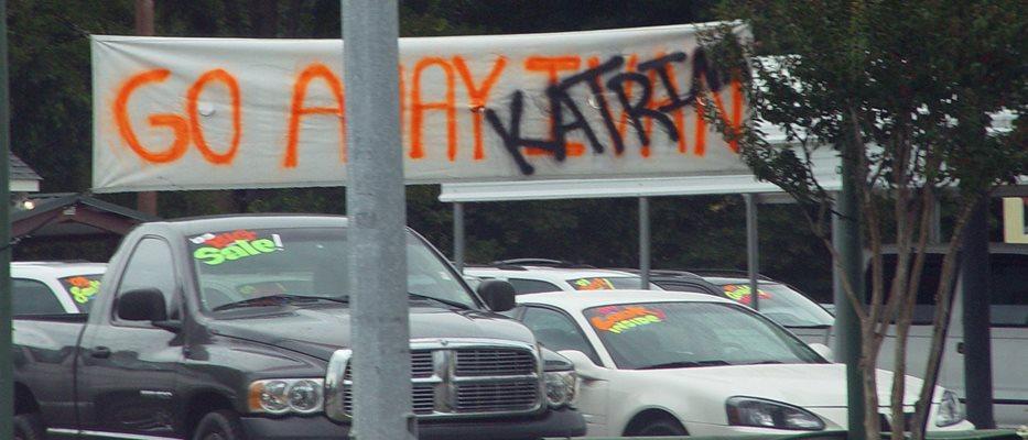 A small car dealership in Ponchatoula, Louisiana, on the Northshore of Lake Ponchatrain, north of New Orleans, displays a message to the hurricanes that have hit this area (Dakota Chichester via Wikimedia Commons)