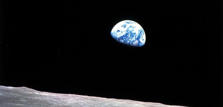 This Dec. 24, 1968, file photo made available by NASA shows the Earth behind the surface of the moon during the Apollo 8 mission. (William Anders/NASA via AP, File)