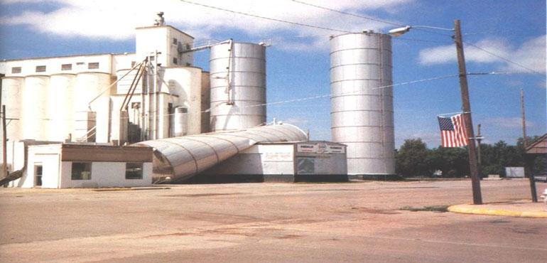 Story Image: Wind damage to a silo is seen at the Valley Center branch of the Andale, Kan., co-op. (Photo by Vanessa Mayes and courtesy "Year of the Storms")