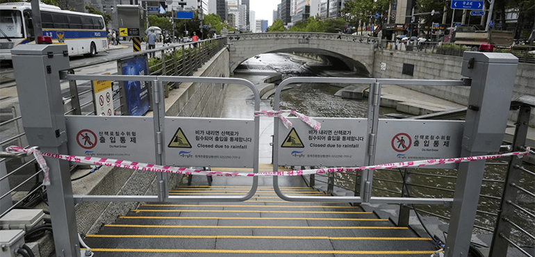 An entrance to the Cheonggye stream is closed in preparation for an approaching Tropical Storm Jongdari in Seoul, South Korea, Wednesday, Aug. 21, 2024. (AP Photo/Ahn Young-joon)