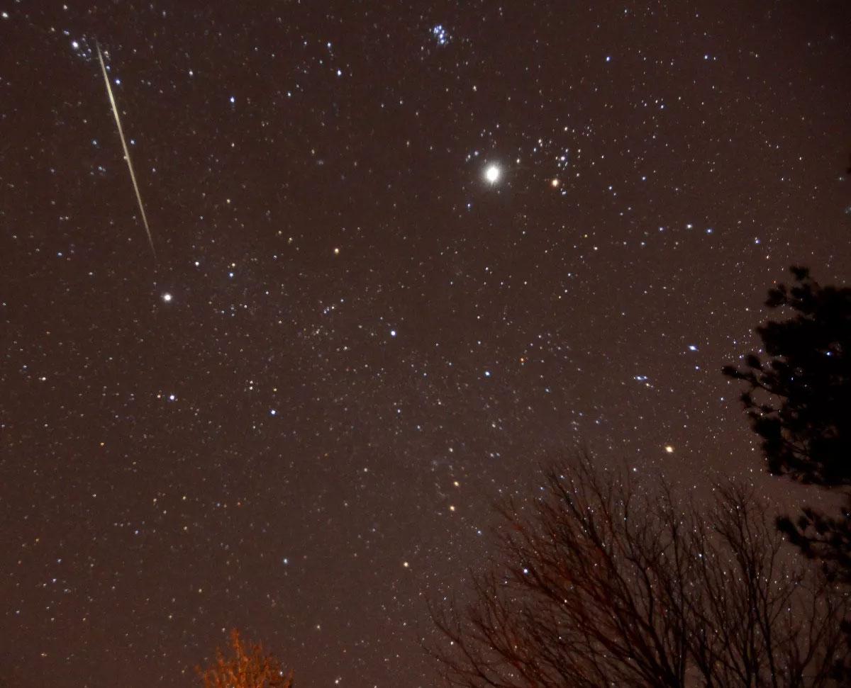 Image: In this Dec. 13, 2012, photo, a meteor flashes across the sky during the Geminid meteor shower over of Springville, Ala. (AP Photo/AL.com, Mark Almond)