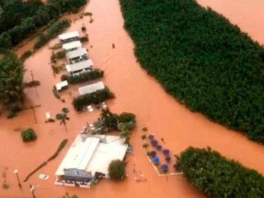 This Sunday, April 15, 2018 image taken from video provided by the U.S. Coast Guard shows flooding in Kauai's Hanalei Bay, Hawaii. Hawaii Gov. David Ige issued an emergency proclamation for the island where heavy rainfall damaged or flooded dozens of homes in Hanalei, Wainiha, Haena and Anahola. (Petty Officer 3rd Class Brandon Verdura/U.S. Coast Guard via AP)