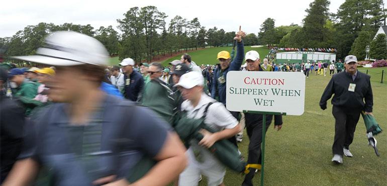 Patrons arrive for the first round during the Masters golf tournament at Augusta National Golf Club, Thursday, Aprill 11, 2024, in Augusta, Ga. (AP Photo/David J. Phillip)