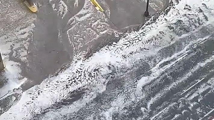 Rivers of hail in downtown Minneapolis on Thursday afternoon.
