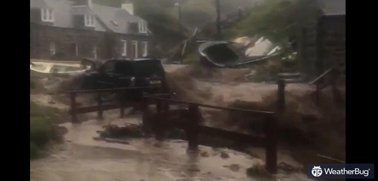 This video shows floodwater rushing through the small village of Crovie on the Aberdeenshire coast.