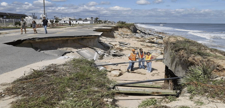 Inspectors looking at beach erosion and washed out roads in St. Augustine, Fla.