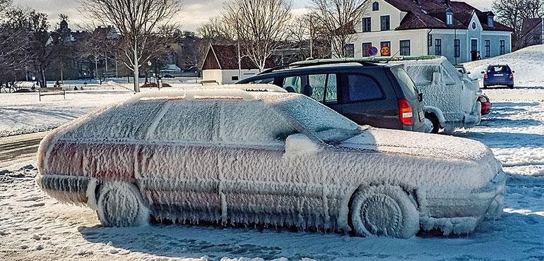 Iced-over cars in the Almedalen parking lot, Visby, Gotland, Sweden, on February 18, 2004. (W. Carter via Wikimedia Commons)