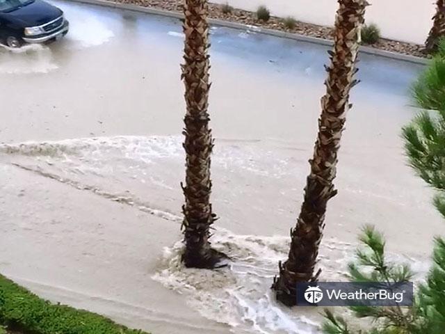 Water can be seen sweeping down a Las Vegas street Tuesday, July 25, 2017. (Instagram/leaplion007 via Storyful)