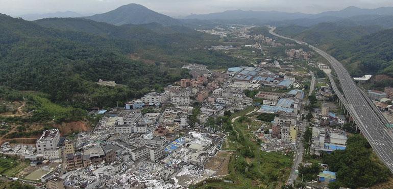An aerial view shows damaged buildings in the aftermath of a tornado in Guangming Village of Zhongluotan Town, Baiyun District, Guangzhou, south China's Guangdong Province, Sunday, April 28, 2024. (Deng Hua/Xinhua via AP)