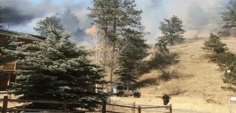 Brush fire ablazed along a hillside in Colorado