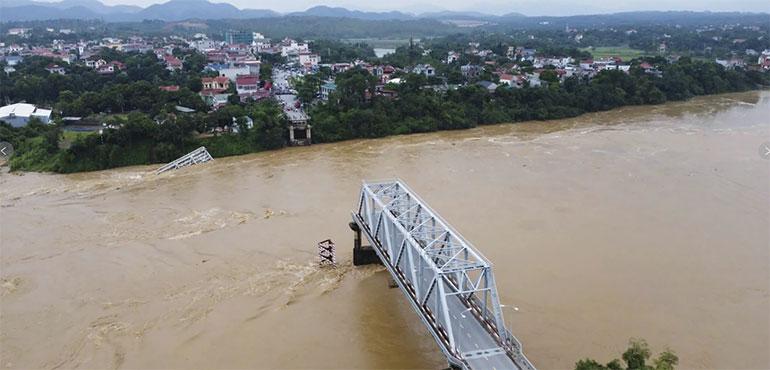 A bridge collapse due to floods triggered by Typhoon Yagi in Phu Tho province, Vietnam on Monday, Sept. 9, 2024 (Bui Van Lanh/ VNA via AP)