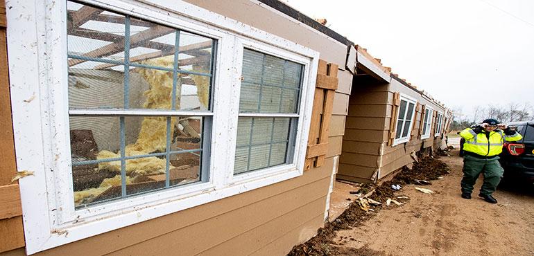 Rescue workers work the scene of the fatal tornado near Beauregard, Ala., on Monday March 4, 2019. Friends in eastern Alabama are helping tornado survivors retrieve the scattered pieces of their lives after devastating winds destroyed their homes and killed at least 23 people. (Mickey Welsh/Montgomery Advertiser via AP)