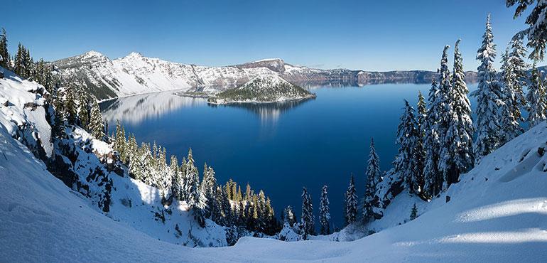 A panoramic winter view of Crater Lake from Rim Village. (WolfmanSF via Wikimedia Commons)