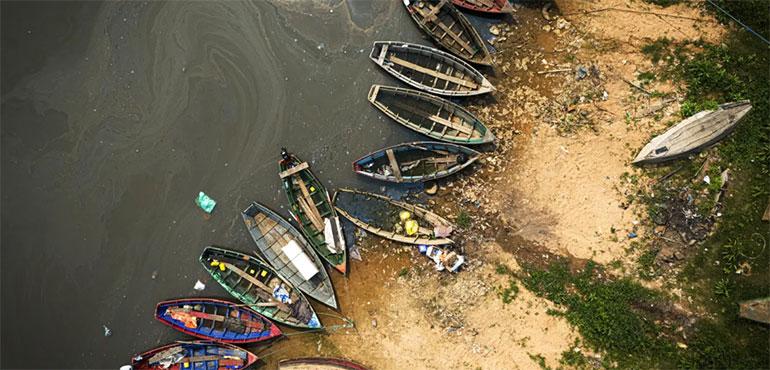 Fishing boats sit on the shore of the Paraguay River in Mariano Roque Alonso, Paraguay, Monday, Sept. 9, 2024. Water levels have plunged to their lowest-ever level amid a drought, according to Paraguay’s Meteorology and Hydrology Office. (AP Photo/Jorge Saenz)