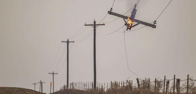 A telephone pole burns from the Smokehouse Creek Fire, Feb. 28, 2024, in Canadian, Texas. (AP Photo/David Erickson, file)