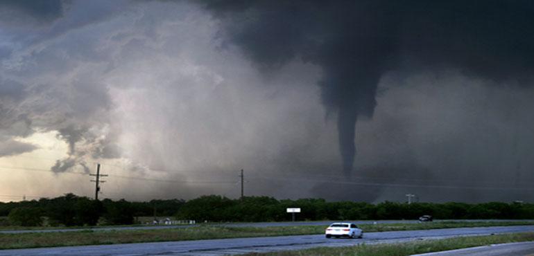 A tornado spins west of Hawley, Texas, as cars pass on U.S. 277 on Thursday, May 2, 2024. (Ronald W. Erdrich/The Abilene Report-News via AP)