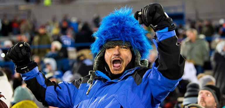 Fans braving the outdoor cold weather, cheer for their team on Feb. 17, 2020 during the outdoor hockey game between the U.S. Air Force Academy and Colorado College in Falcon Stadium.(U.S. Air Force photo/Trevor Cokley via Wikimedia Commons)