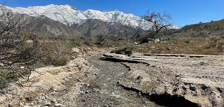 The Recovery and Flooding Aftermath of the El Dorado Fire Area in California looking at the Plants trying to recover and the Excess Runoff causing a flood delta and erosion. (Gerald Peplow via Shutterstock)