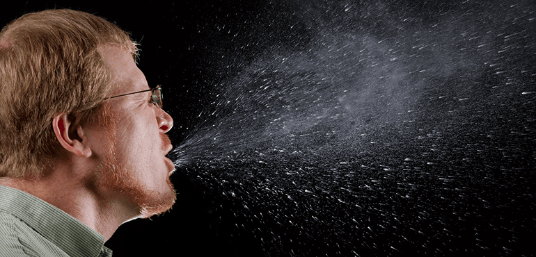 This 2009 photograph captured a sneeze in progress, revealing the plume of salivary droplets as they are expelled in a large cone-shaped array from this man`s open mouth, thereby dramatically illustrating the reason one needs to cover his/her mouth when coughing, or sneezing, in order to protect others from germ exposure. Courtesy: CDC Public Health Image Library ID 11162.