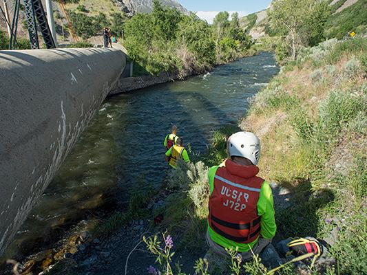 The Salt Lake Tribune Provo Firefighters and search and rescue workers scan the Provo River Tuesday, May 30, 2017, for a child and possibly an adult that were washed down the river on Provo Canyon Monday. (Rick Egan/The Salt Lake Tribune via AP)