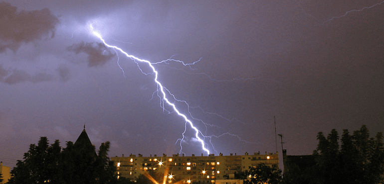 Cloud-to-ground lightning strike, taken by Axel Rouvin on November 3, 2005.