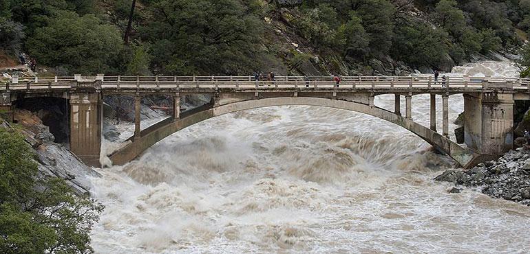 Flood under the Old Route 49 bridge crossing over the South Yuba River in Nevada City, California, saw local and regional visitors during the atmospheric river event across Northern California on January 9, 2017.
