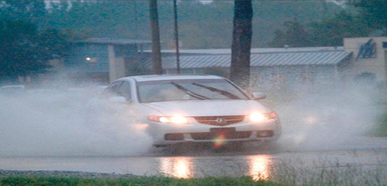 Story Image: A driver drives through high water on Dale Drive in Marion, Miss., on Wednesday, Aug. 24, 2022. Parts of Mississippi recieved several inches of rain throughout the day. (D'Courtland Christian/The Meridian Star via AP)