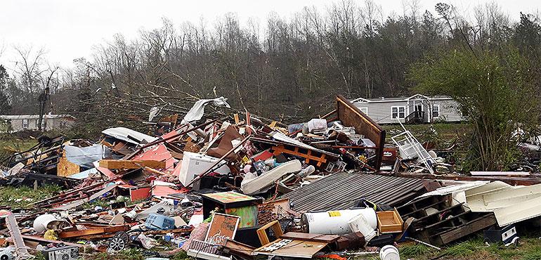 Piles of debris remain after a tornado touched down killing several people and damaging multiple homes, Thursday, March 25, 2021 in Ohatchee, Ala. (AP Photo/Butch Dill)