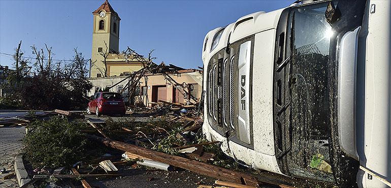 Overturned truck and damaged church are seen after a tornado hit the village of Moravska Nova Ves in the Hodonin district, South Moravia, Czech Republic, on Friday, June 25, 2021. (Sale Vaclav, AP)