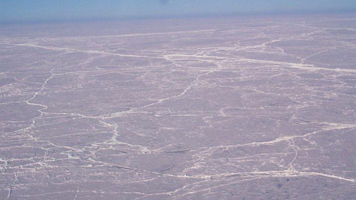 Arctic Ice seen with pressure ridges seen along a dog sled trip to the North Pole on April 1, 2007 (Collection of Dr. Pablo Clemente-Colon, Chief Scientist National Ice Center/NOAA Photo Library).