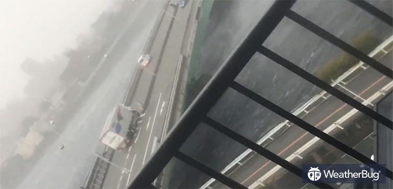 Truck crosses bridge during high wind event caused by Typhoon Jebi.
