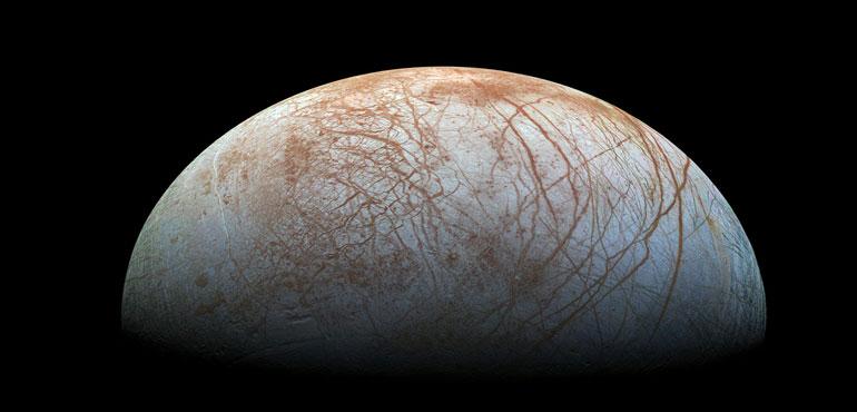 The puzzling, fascinating surface of Jupiter's icy moon Europa looms large in this newly-reprocessed color view, made from images taken by NASA's Galileo spacecraft in the late 1990s. (NASA / Jet Propulsion Lab-Caltech / SETI Institute/Wikimedia Commons).