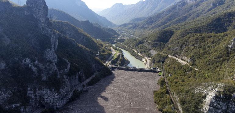 Aerial view of waste stuck at the dam on the Neretva river caused by landslides, torrential rain and flash floods in Grabovica, Bosnia, Sunday, Oct. 13, 2024. (AP Photo/Armin Durgut)