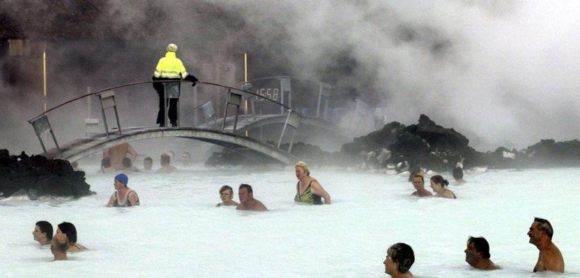 Bathers enjoy the warm water of the Blue Lagoon on Iceland on Sept. 5, 20023. (AP Photo/Frank Augsein, File)
