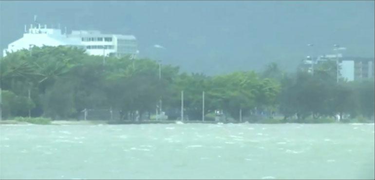 This image made from video show heavy seas in Cairns, Australia Wednesday, December 13, 2023. Powerful winds began uprooting trees on the northeast Australian coast on Wednesday as Tropical Cyclone Jasper gathered strength while approaching the area. (Australian Broadcasting Corporation via AP)
