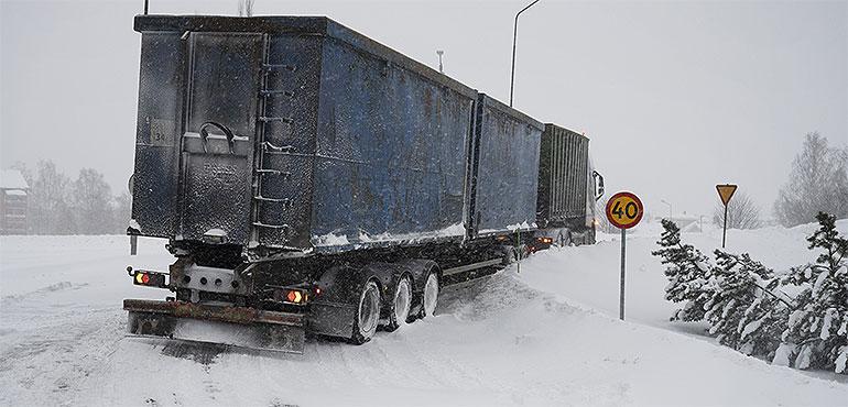 A truck is stuck in the snow in Umeaa, Sweden, Tuesday Jan. 12, 2021. (Erik Abel / TT via AP)