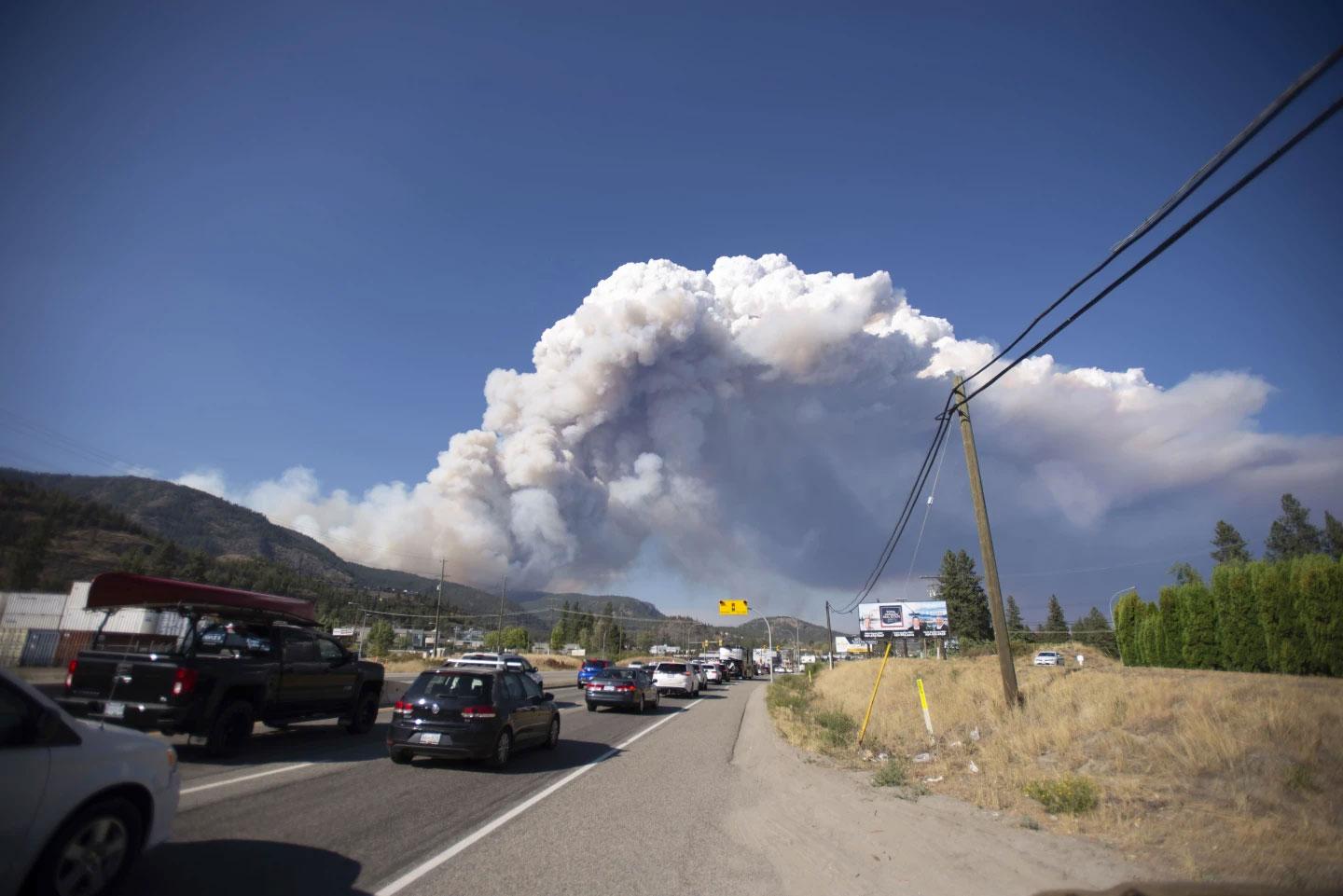Smoke from the McDougall Creek wildfire is seen from Westbank, British Columbia, Thursday, Aug. 17, 2023. (Joe O'Connal/The Canadian Press via AP)