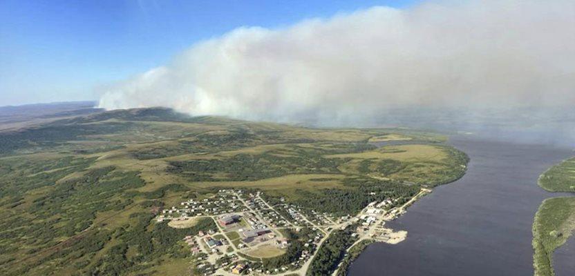 This aerial photo provided by the Bureau of Land Management Alaska Fire Service shows a tundra fire burning near the community of St. Mary's, Alaska, on June 10, 2022. (Ryan McPherson/Bureau of Land Management Alaska Fire Service via AP, File)