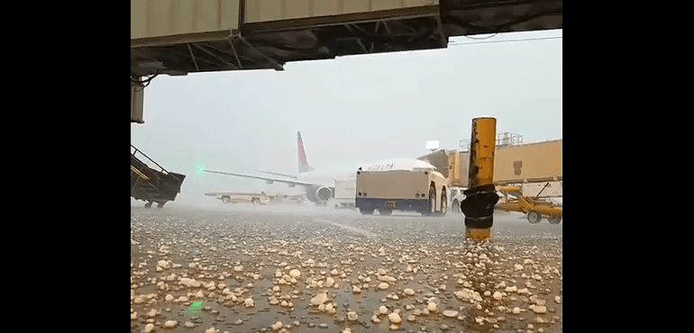 Screen capture of hail hitting the tarmac at Kansas City, Mo., airport.