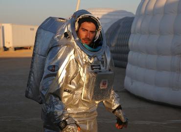 This Feb. 7, 2018, photo shows João Lousada, a flight controller for the International Space Station, wearing an experimental space suit during a simulation of a future Mars mission in the Dhofar desert of southern Oman. (AP Photo/Sam McNeil)
