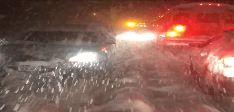 Heavy snow causes people to abandon vehicles in Buffalo, NY.